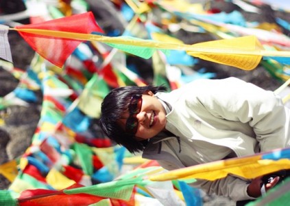 Drowned amidst colourful prayer flags in Tibet